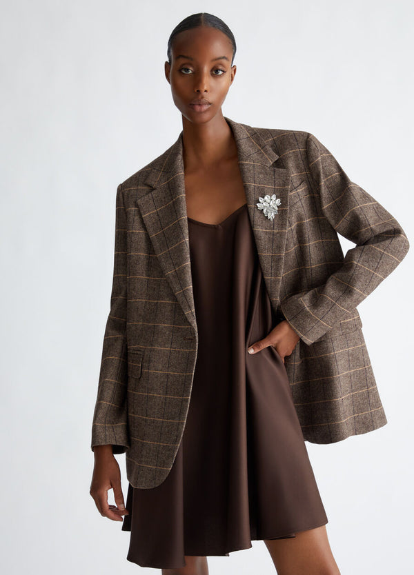 Chequered blazer with bejewelled brooch detail